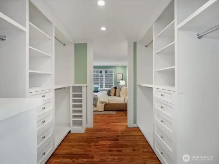 An incredible, oversized walk-in closet with custom shelving completes the primary suite.