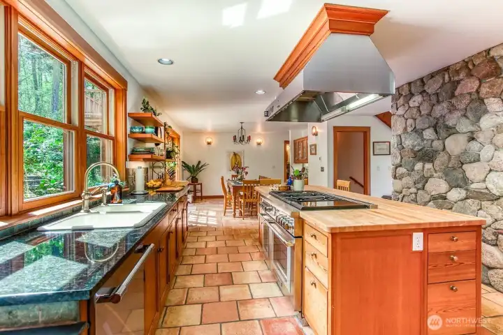 New appliances include Subzero built-in refrigerator, Thermador 48" six burner range with convection griddle and double oven.