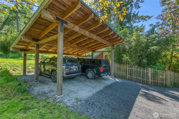 Custom-built carport near the house entry gate and carport gate.