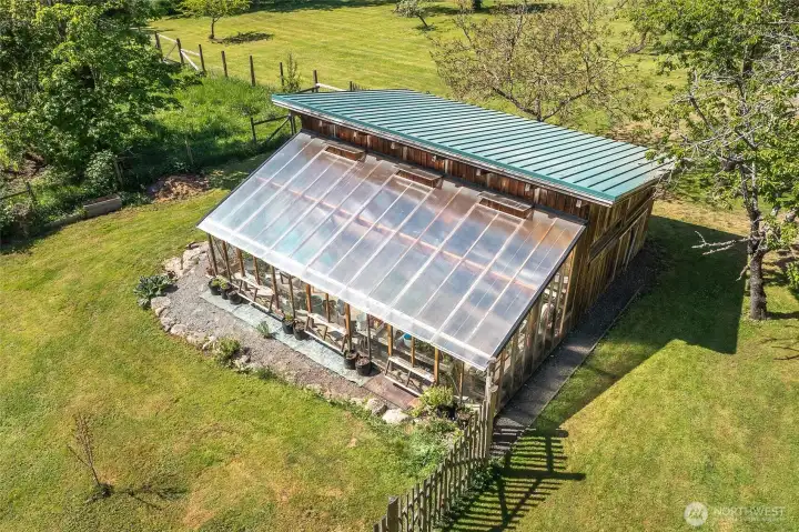 Detached greenhouse and shop.