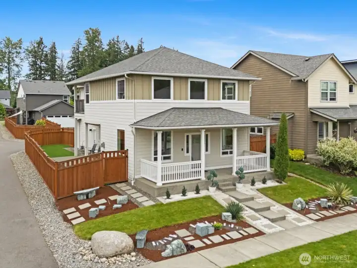 Thoughtful landscaping includes sprinkler system.