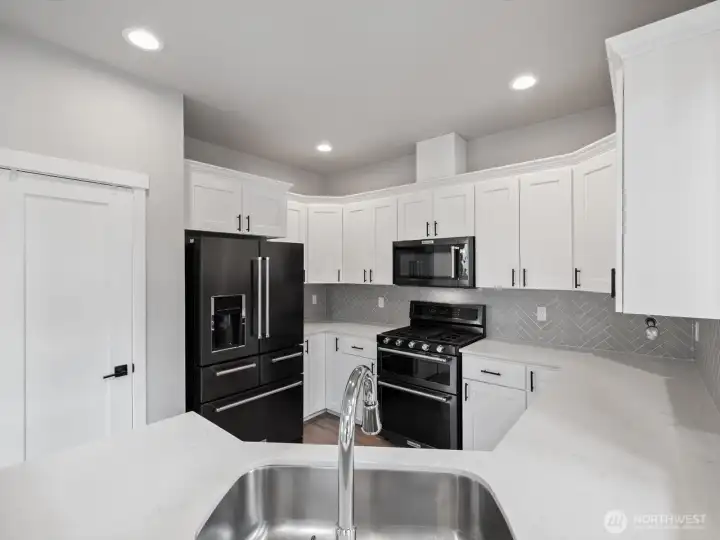 Upgraded black SS KitchenAid appliances.
