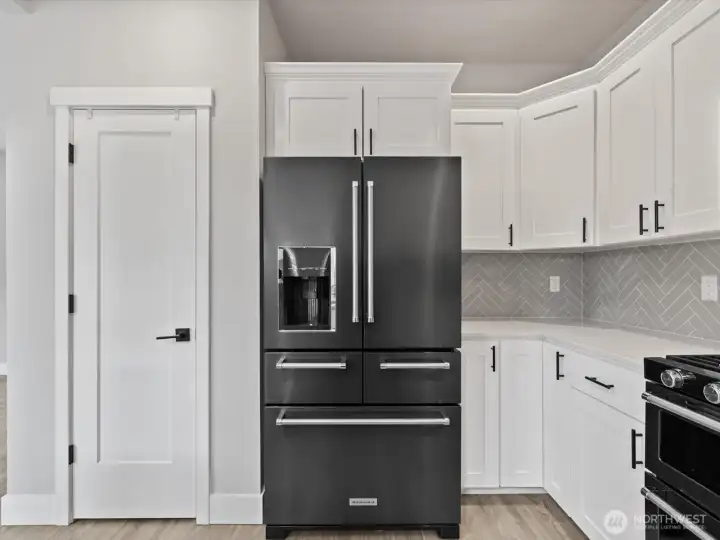 Pantry closet next to fridge. All appliances stay!