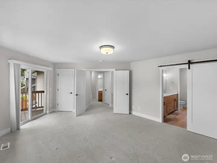 Primary suite w/ slider to covered balcony + WIC.