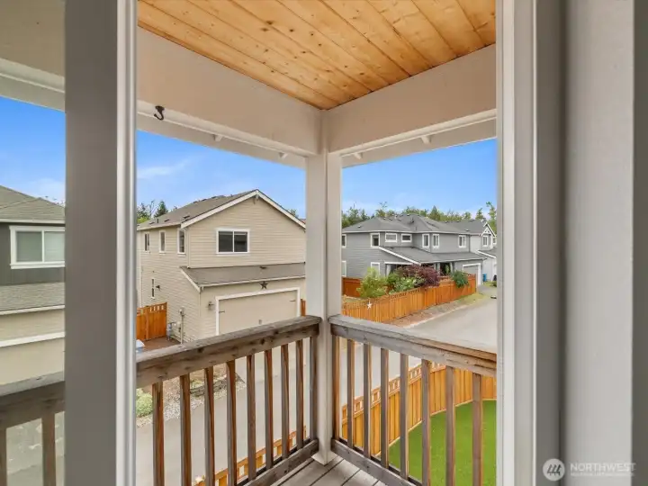 Covered balcony off primary suite.