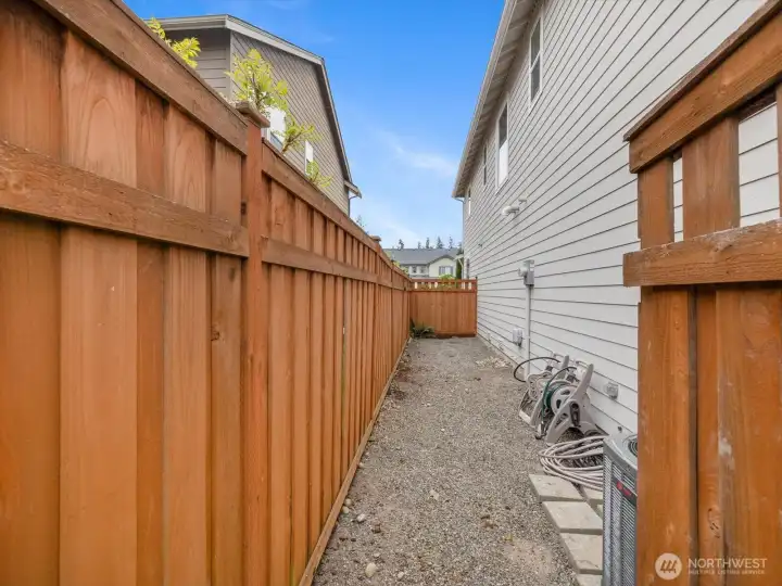 Great place for a dog run, placing raised garden beds or storage shed.