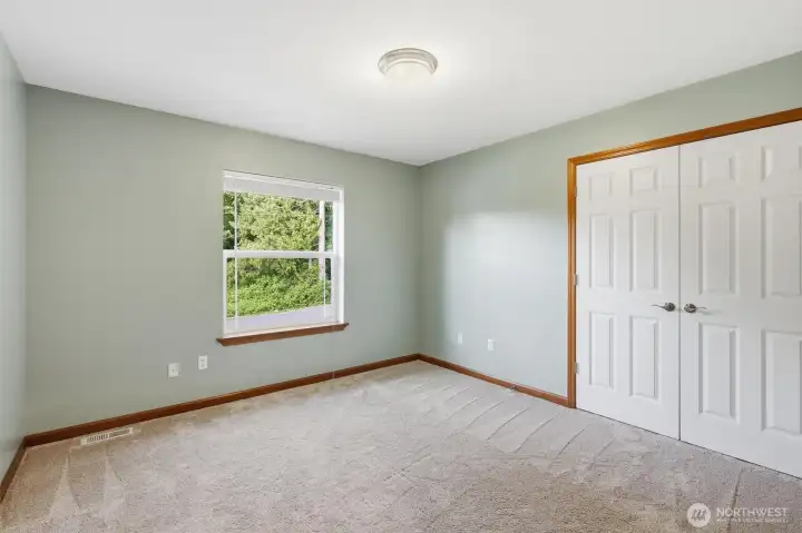 One of two of the upstairs bedrooms. One facing the street and the other overlooking backyard.