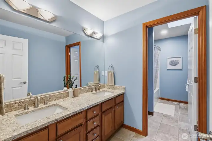Oversized upstairs guest bathroom.