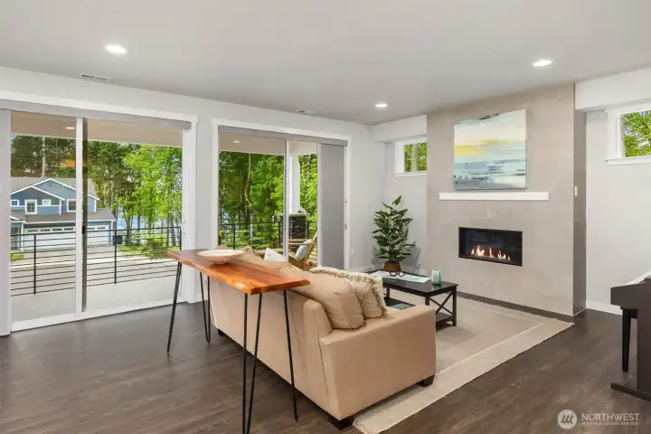 Huge sliders to covered front deck, with southern exposure and filtered water views.
