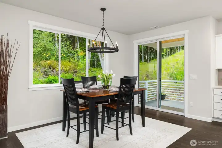 Dining area opens to back deck.