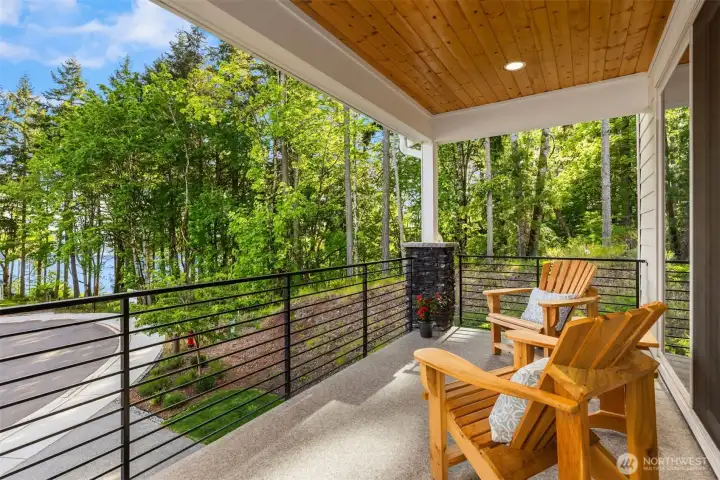 Covered front deck enjoys filtered water views with southern exposure.