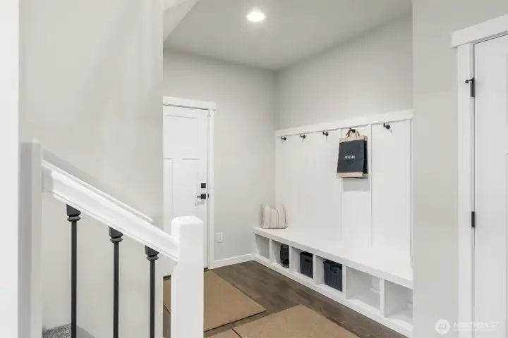 Large mudroom off garage level for coats and shoes.