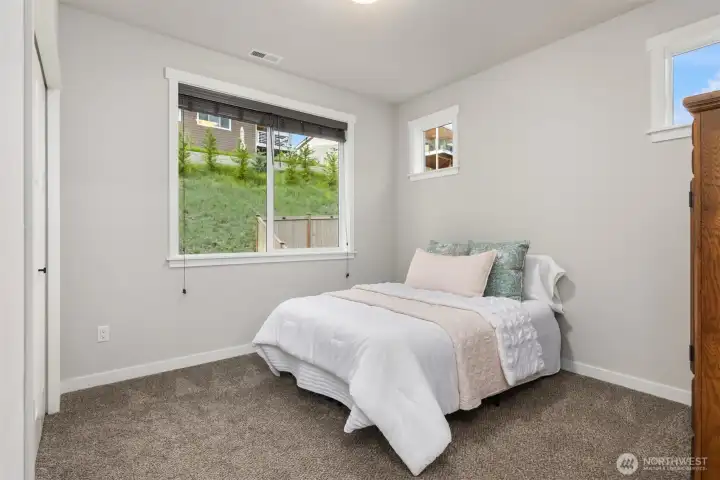 Guest suite on middle level has ensuite bath.