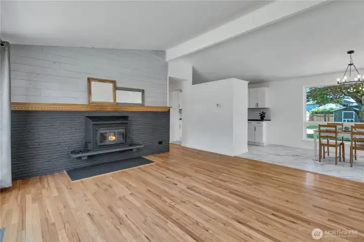 Living room w/vaulted ceilings & wood burning fireplace