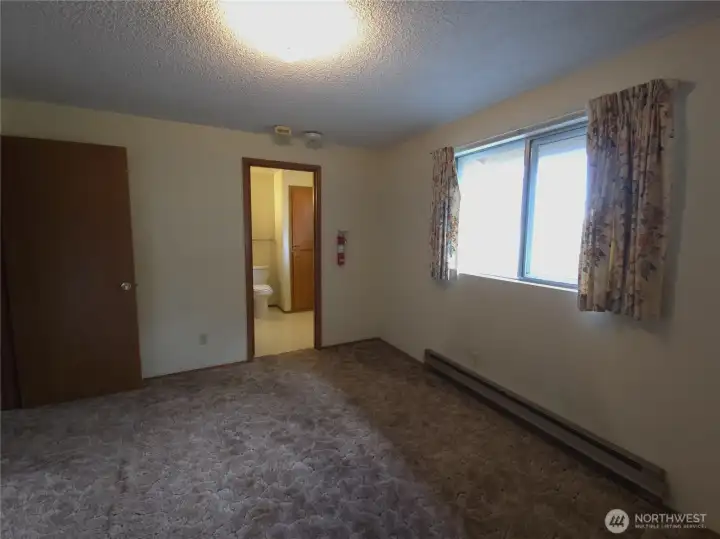 Primary bedroom with access to main bath