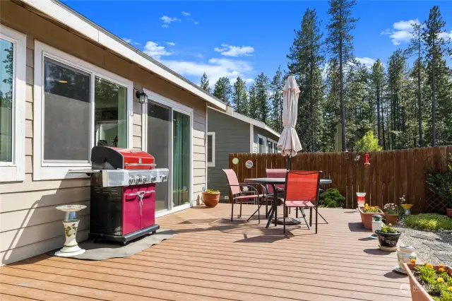 Take in the view of surrounding evergreens as you relax at this private deck.