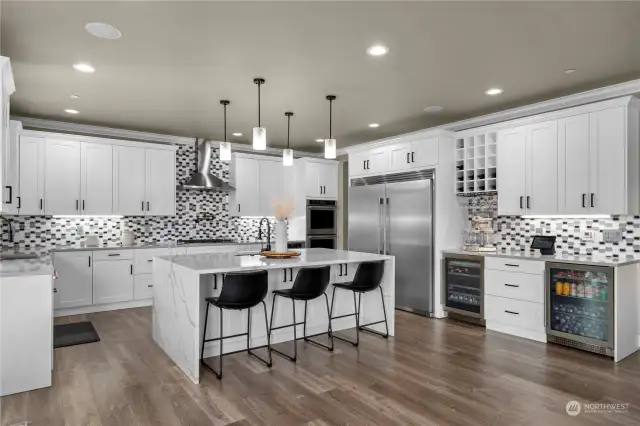 Top of the line kitchen with oversized island with bar seating.