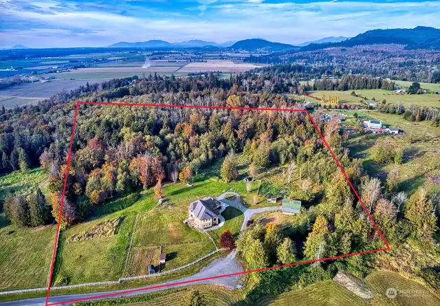 10 acres that provide a combination of sloping hillside and cozy forest with trails