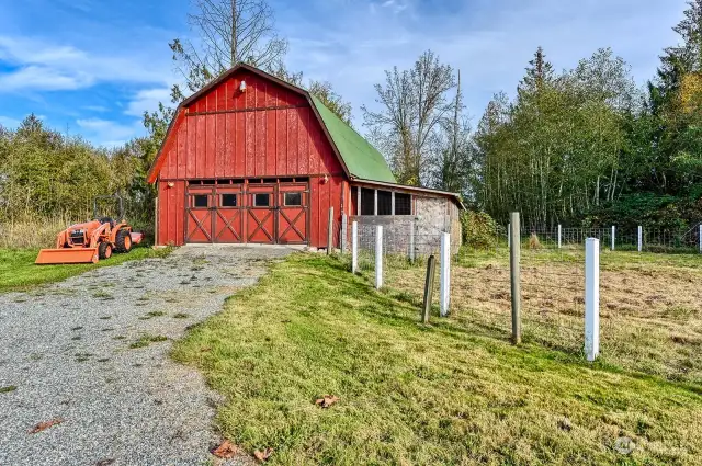 a Big Red Barn, concrete floor and loft storage.