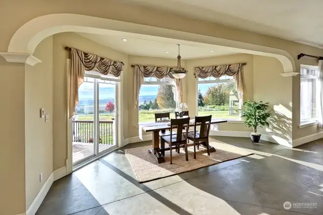 Breakfast nook with stunning views and door opening to the deck.