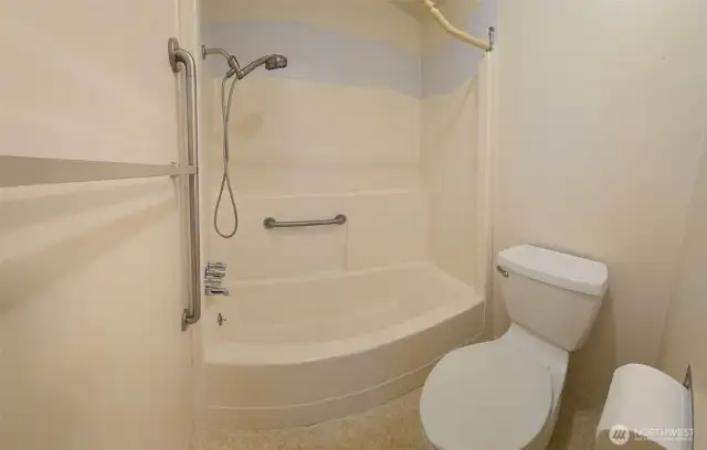 Shower and commode area of bathroom in unit 1211