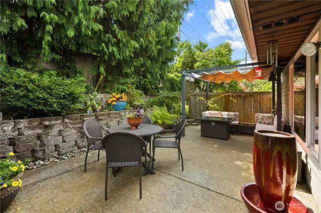 Surrounded by lush greenery and mature landscaping, the space feels private and serene.
