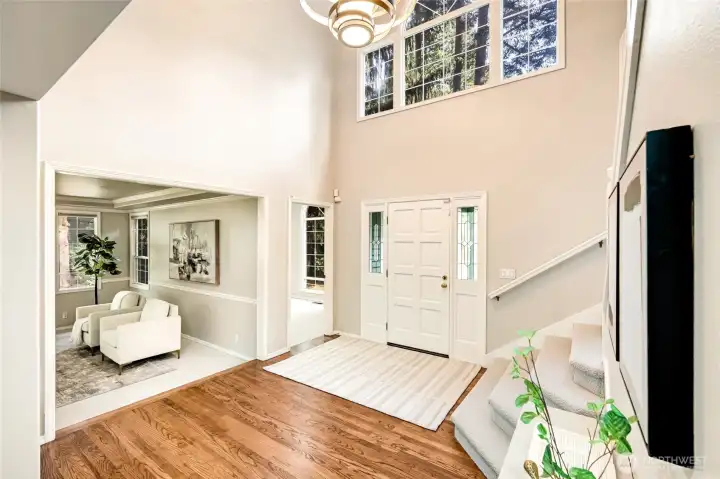 Step into a warm, inviting home where sunlight dances across refinished hardwood floors.