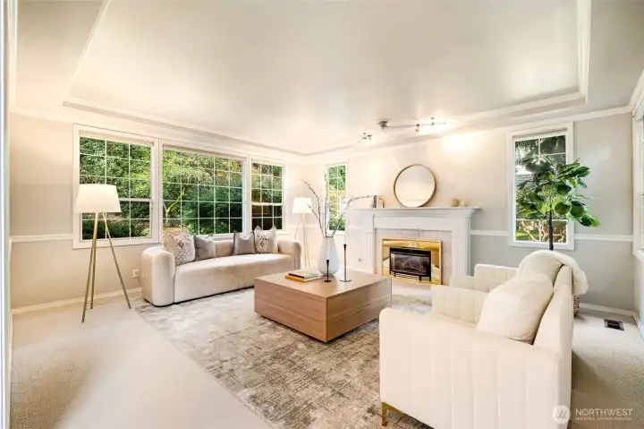 The formal living room exudes elegance and comfort, perfect for intimate gatherings or quiet reflection with a favorite book.