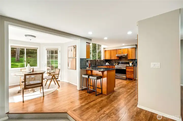 Refinished hardwood flooring flows from the foyer to through the home to the kitchen, family room & breakfast nook.