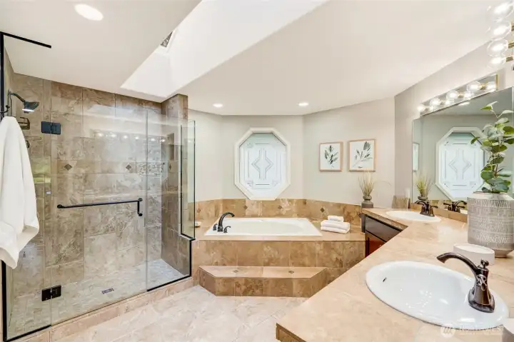 Spa-inspired 5-piece bath with a jetted tub, abundant natural light, and a private retreat provide the perfect space to unwind after a busy day.