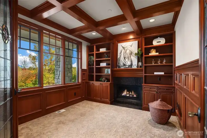 Fireside den off entry with built-ins, leaded french doors and wonderful acreage views.
