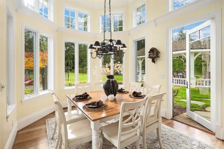 Spacious Breakfast nook with access to a covered outdoor living space with commercial size pizza oven and tremendous seating space
