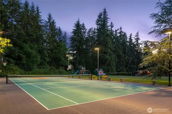 Full size tennis/sport court, lush level lawn spaces