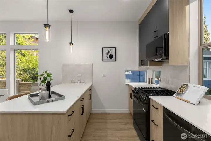 This kitchen view highlights clean lines, modern appliances, and an abundance of workspace.