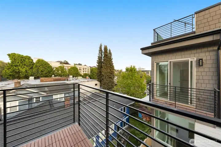 Enjoy fresh air and views from your private outdoor balcony, just steps from your bedroom.