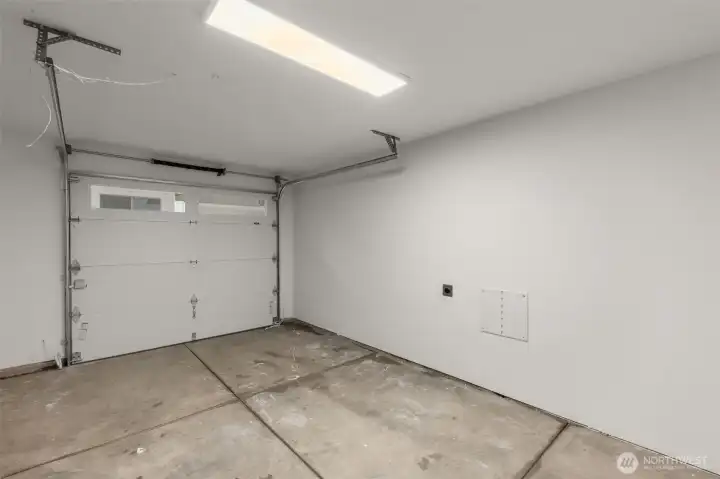 Attached garage offers convenience with EV-ready setup and extra room for storage.