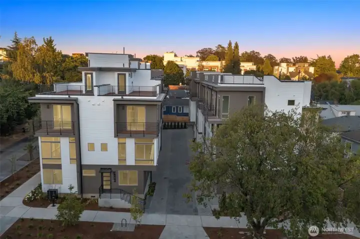 At twilight, the exterior glows with curb appeal, highlighting thoughtful craftsmanship and a collection that feels both private and connected to the neighborhood.