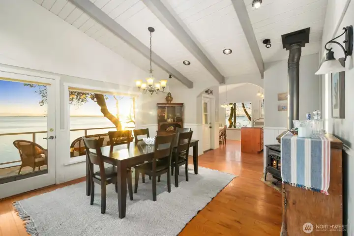 Water-view dining area where natural light and tranquil scenery elevate everyday moments.