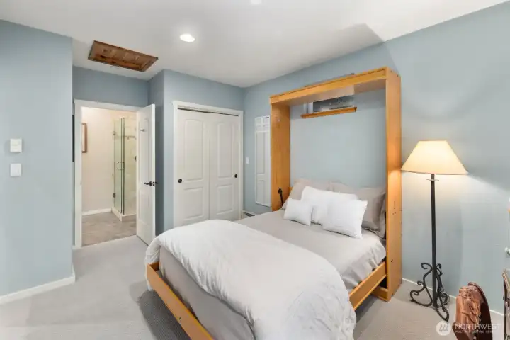 Comfortable main-level guest suite with private 3/4 bath—perfect for visitors seeking privacy and convenience.