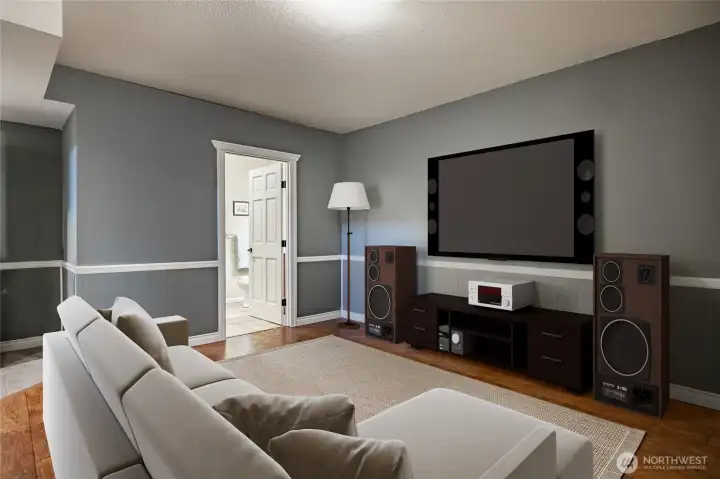 Lower-level media or family room - virtually staged
