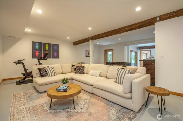 The spacious lower level includes a large rec room and plumbing access for a future kitchenette or bar.