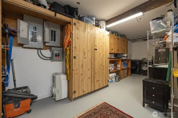 Laundry/utility room with ample storage.