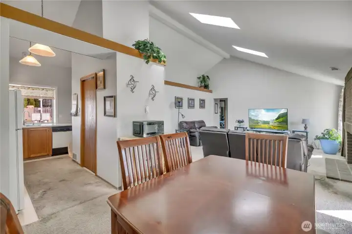 Open-concept dining and living space with great sightlines throughout. Such a wonderful, bright and open feel!