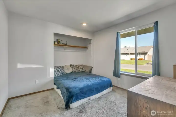 The secondary bedroom is large and there is ample space for dressers, etc.