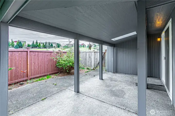 Covered patio with a skylight adjacent to the family/dining room
