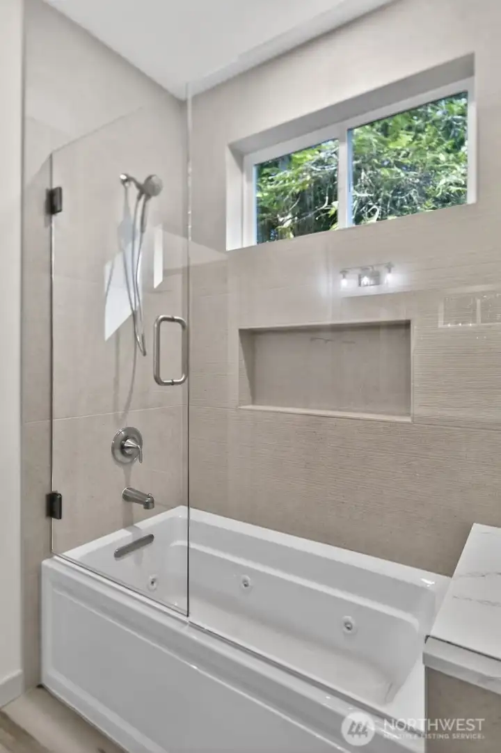 Jetted tub with shower