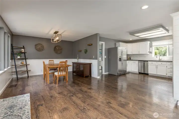 Enjoy an open floor plan with a seamless flow between the dining area and the kitchen