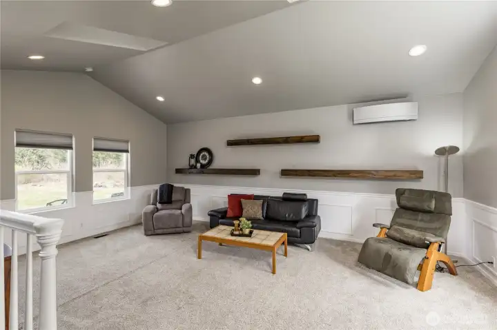 Modern touches meet comfort: stylish floating shelves offer a custom look, while the efficient mini-split system provides perfect climate control year-round