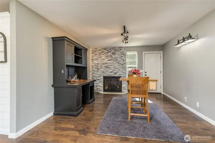 Convenient wet bar and cozy gas fireplace, perfect for hosting or enjoying a quiet evening at home