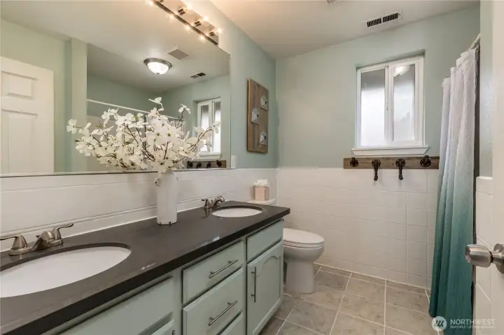 Full upstairs bathroom with dual sinks